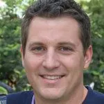 John Moore, a professional in his field, smiling confidently at the camera