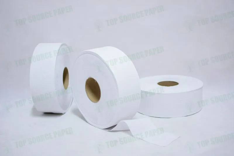 A stack of premium jumbo toilet paper rolls ready for use