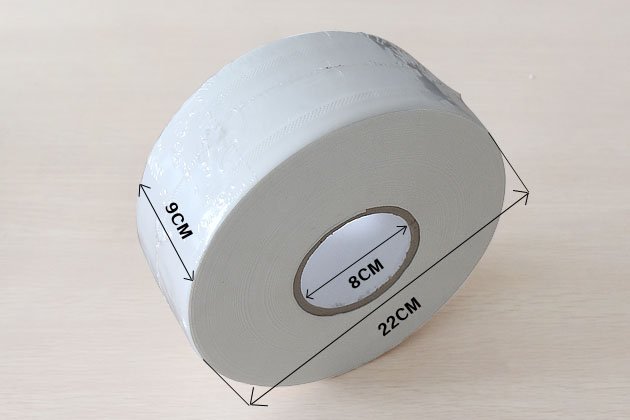 Jumbo toilet paper roll cross-section showing multi-ply virgin pulp fiber structure