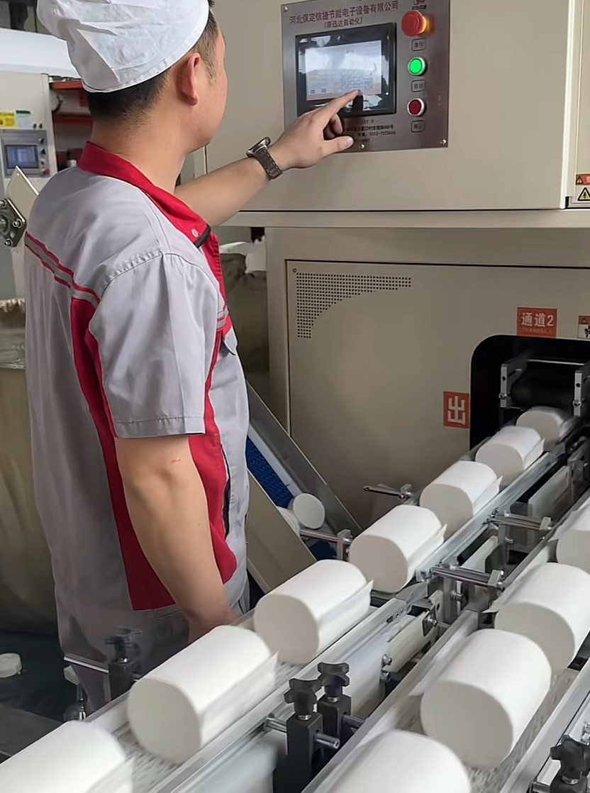 Packing line for retail tissue packs