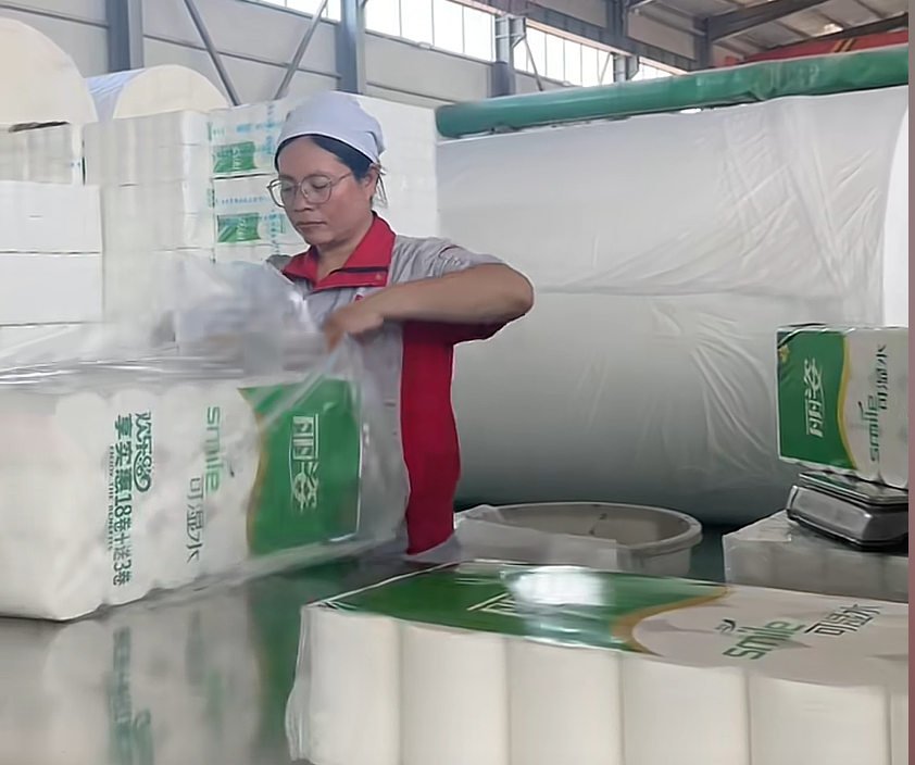 In-line quality control inspection of tissue rolls