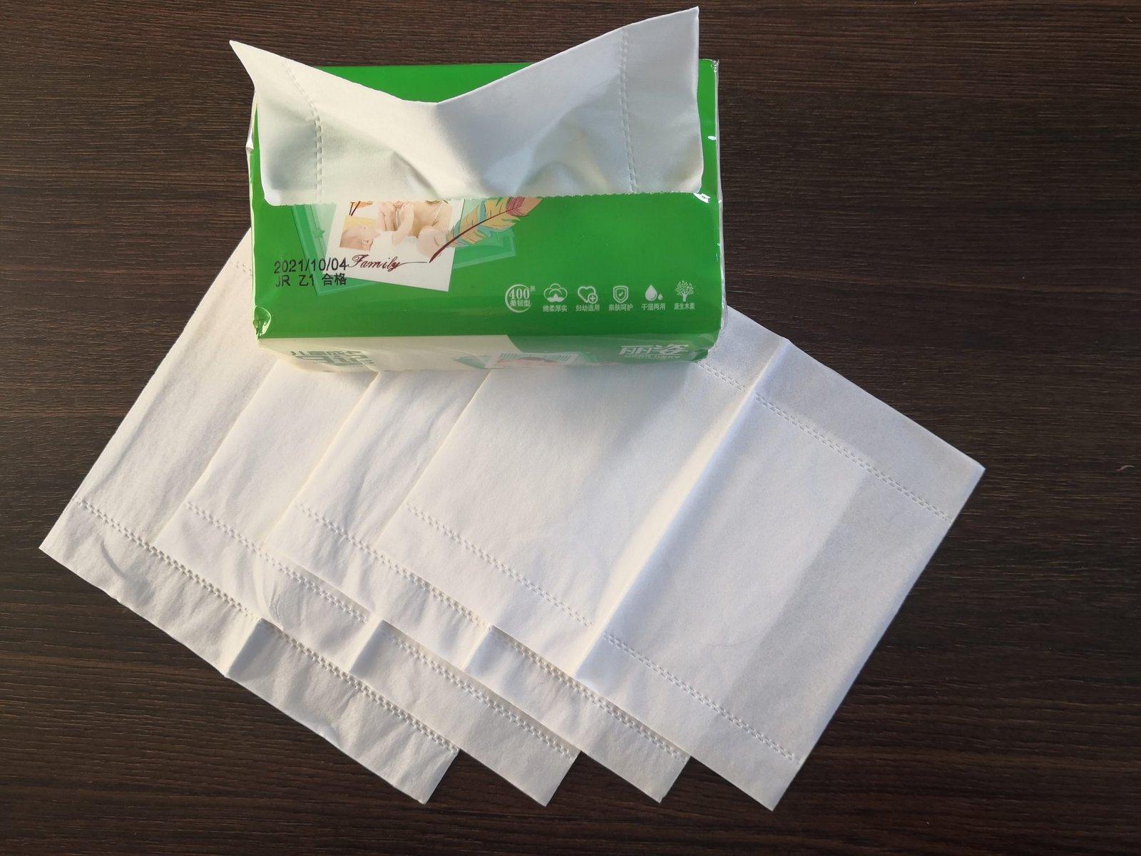 Silky embossing pattern on unfolded facial tissue sheets